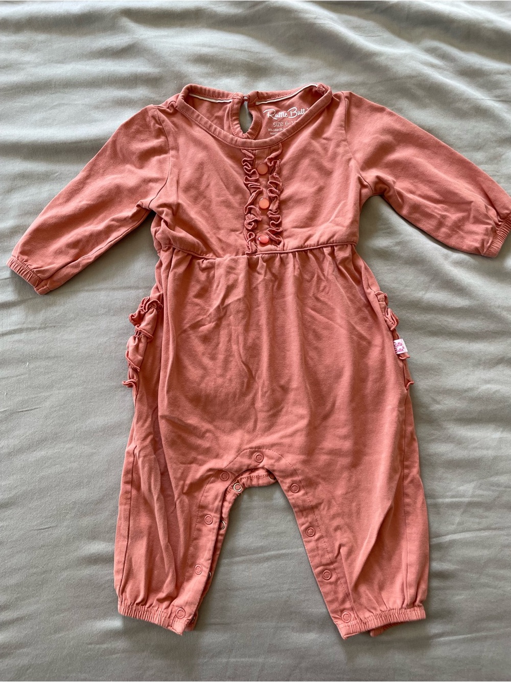 Ruffle Butts Coral Pink Long Sleeve One-Piece